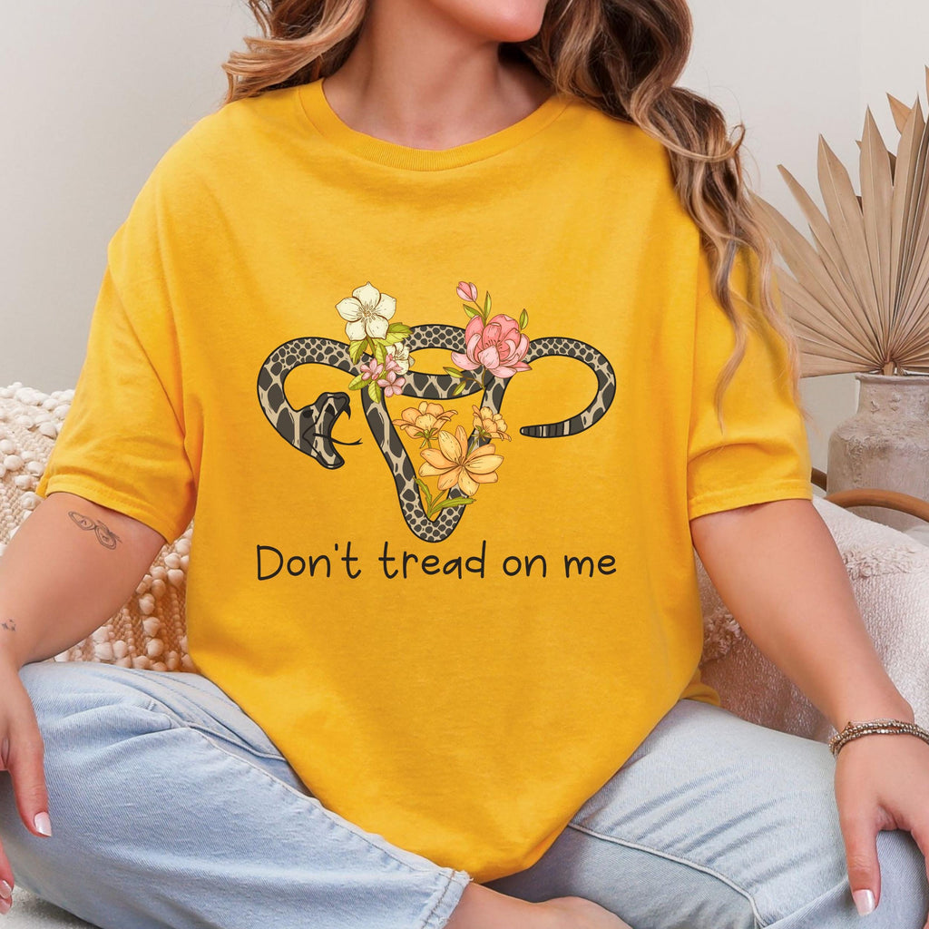 Don’t Tread on Me graphic shirt featuring Feminist Snake Uterus Graphic Tee