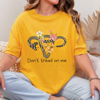 Don’t Tread on Me graphic shirt featuring Feminist Snake Uterus Graphic Tee