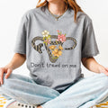Don’t Tread on Me graphic shirt featuring Feminist Snake Uterus Graphic Tee