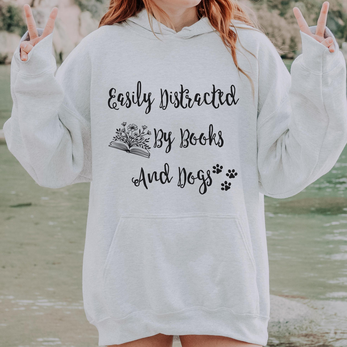 Easily Distracted by Books and Dogs graphic hoodie featuring Book Lover Dog Mom Sweatshirt
