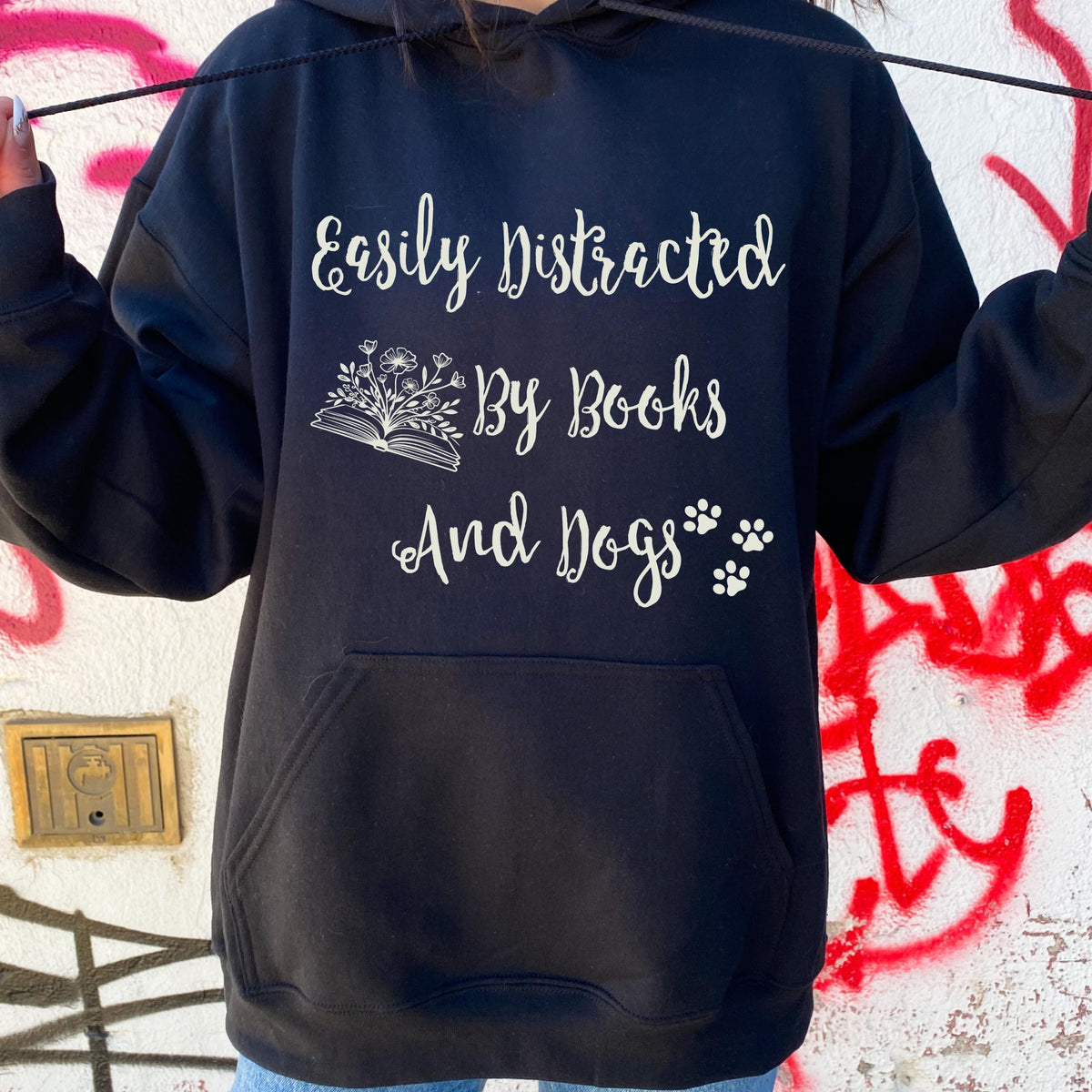Easily Distracted by Books and Dogs graphic hoodie featuring Book Lover Dog Mom Sweatshirt
