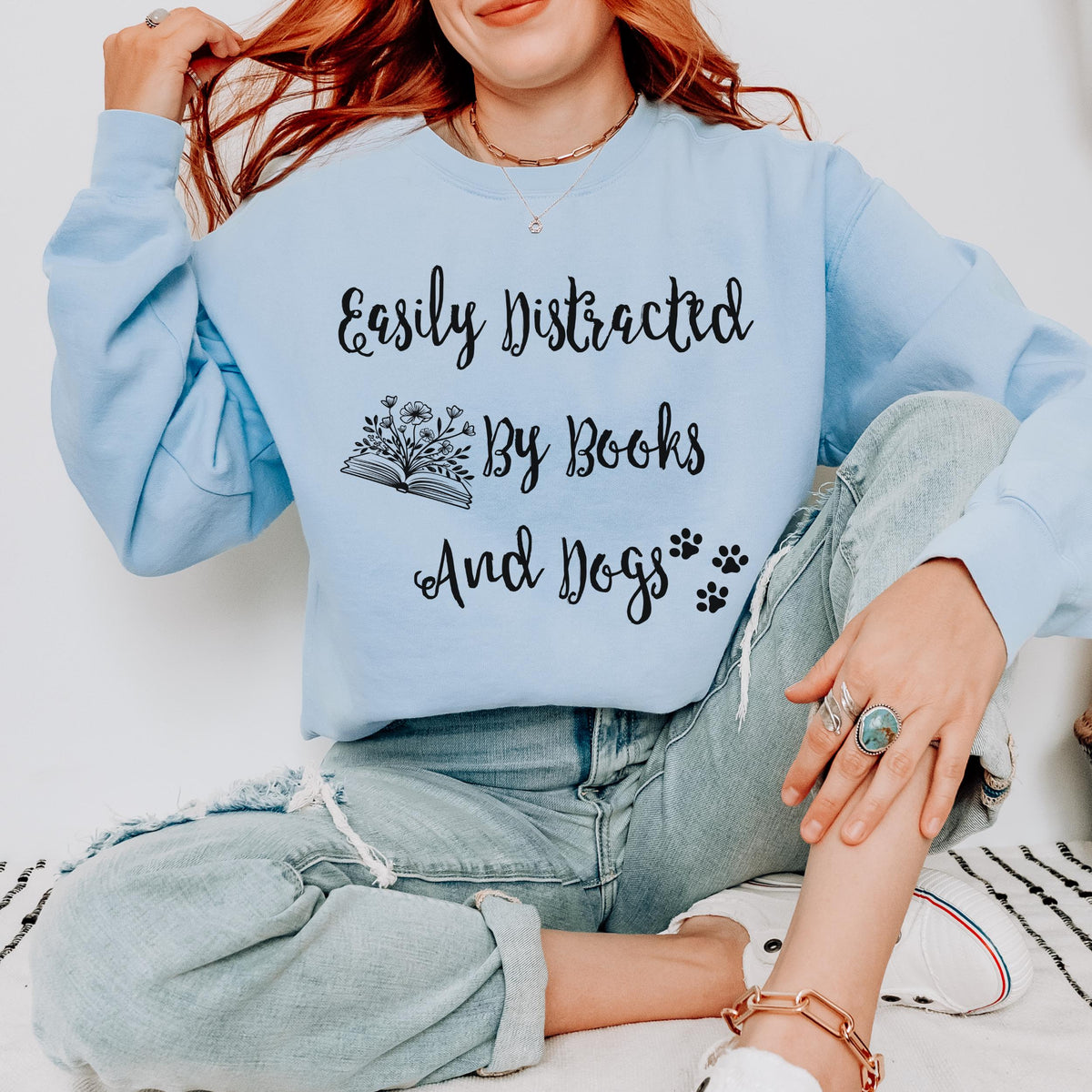 Easily Distracted by Books and Dogs graphic sweatshirt featuring Book Lover Dog Crewneck