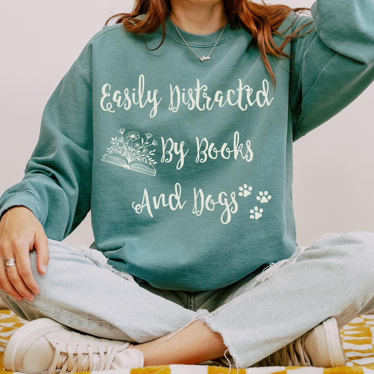 Easily Distracted by Books and Dogs graphic sweatshirt featuring Book Lover Dog Crewneck