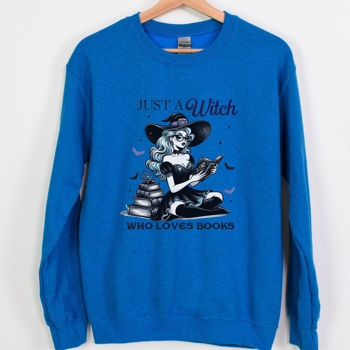 Just a Witch Who Loves Books graphic sweatshirt featuring Witchy Book Lover Crewneck