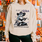 Just a Witch Who Loves Books graphic sweatshirt featuring Witchy Book Lover Crewneck