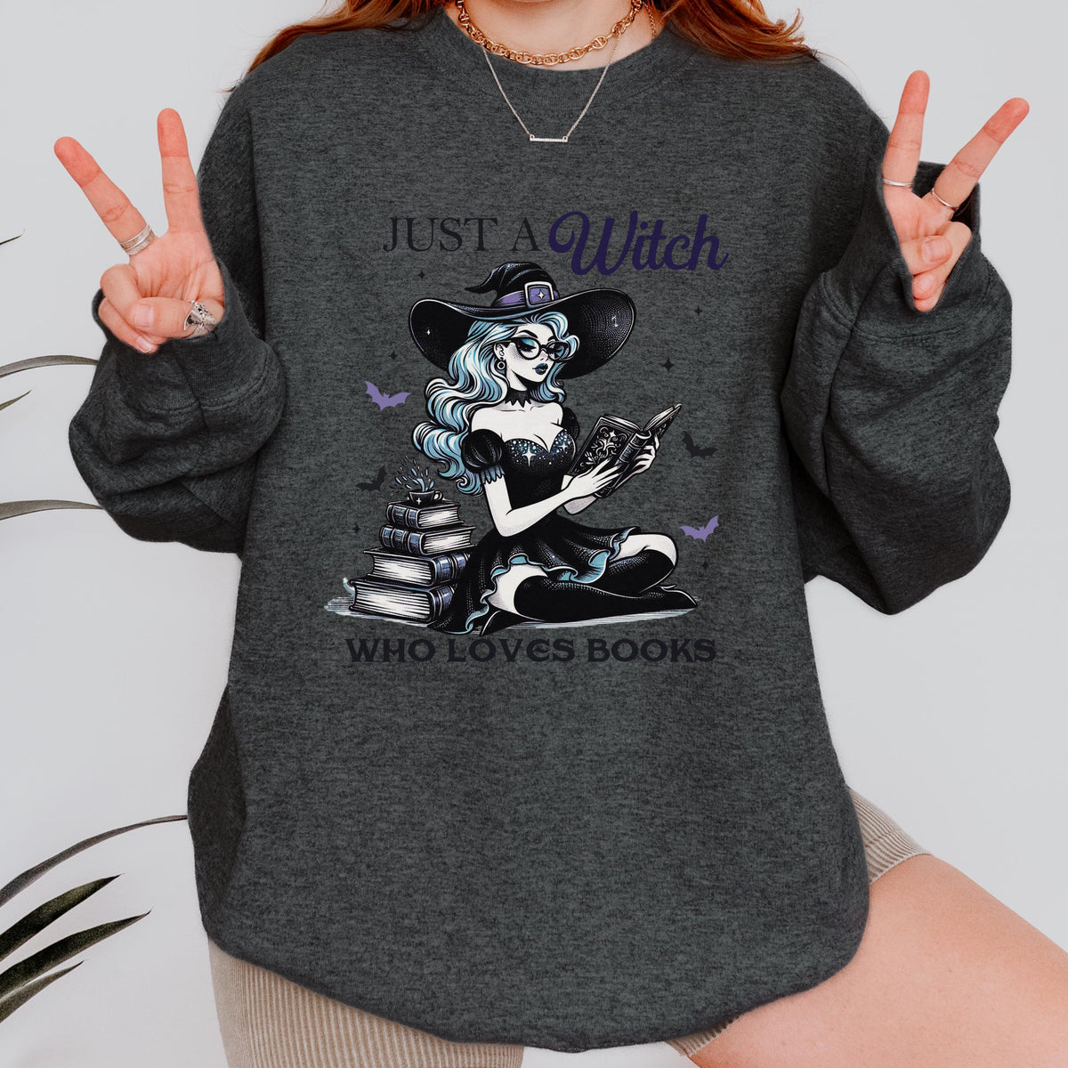 Just a Witch Who Loves Books graphic sweatshirt featuring Witchy Book Lover Crewneck