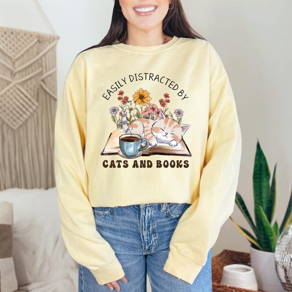 Easily Distracted by Cats and Books graphic sweatshirt featuring Book Lover Cat Crewneck in Blue Jean