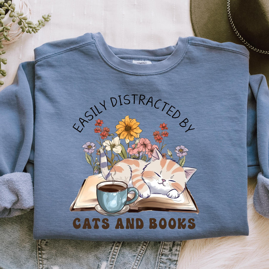 Easily Distracted by Cats and Books graphic sweatshirt featuring Book Lover Cat Crewneck