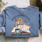 Easily Distracted by Cats and Books graphic sweatshirt featuring Book Lover Cat Crewneck
