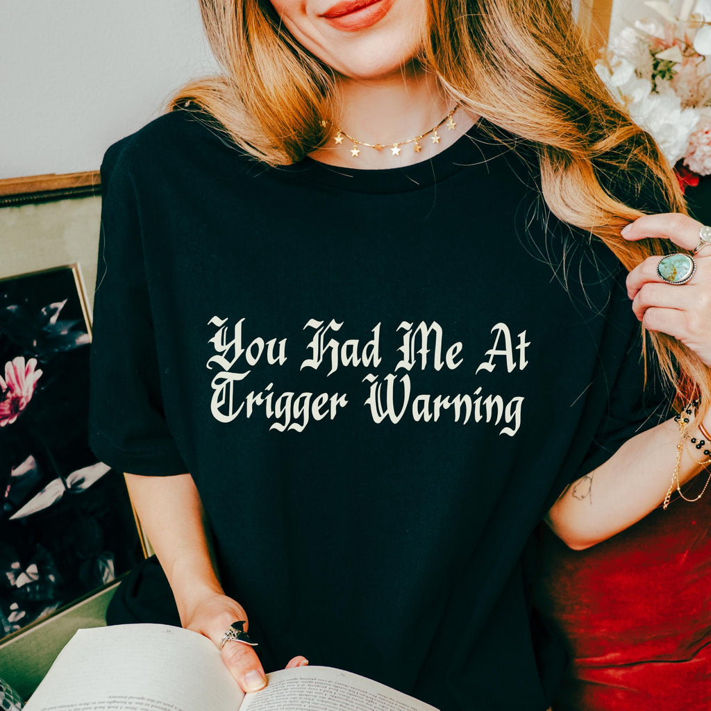 You Had Me at Trigger Warning graphic shirt featuring Funny Book Lover Graphic Tee in Black