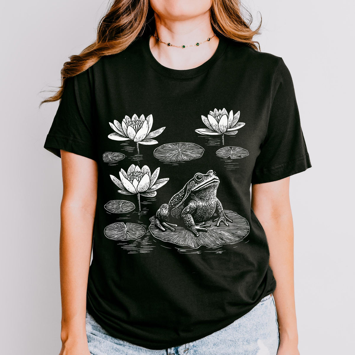 Frog graphic shirt featuring Linocut Frog & Water Lily Graphic Tee in Black