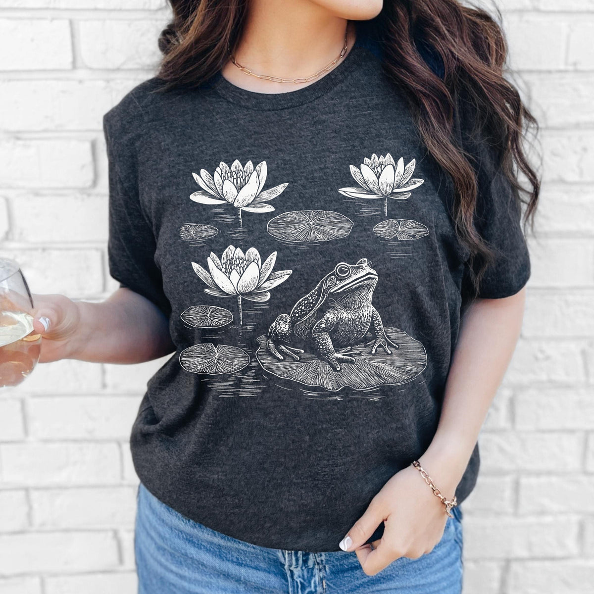 Frog graphic shirt featuring Linocut Frog & Water Lily Graphic Tee