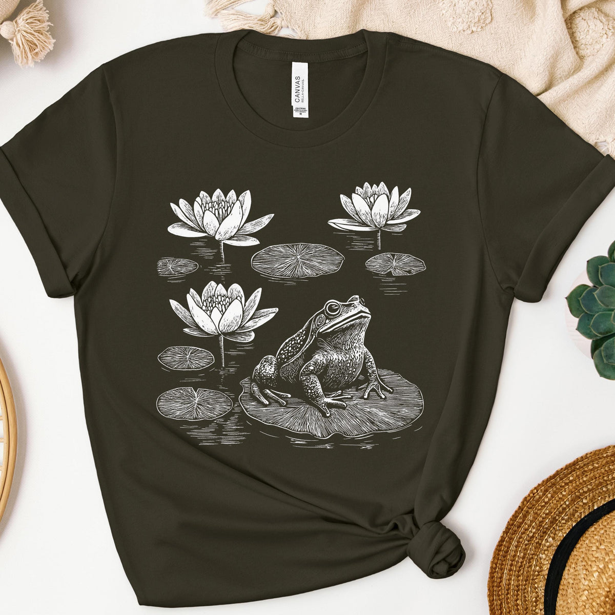 Frog graphic shirt featuring Linocut Frog & Water Lily Graphic Tee