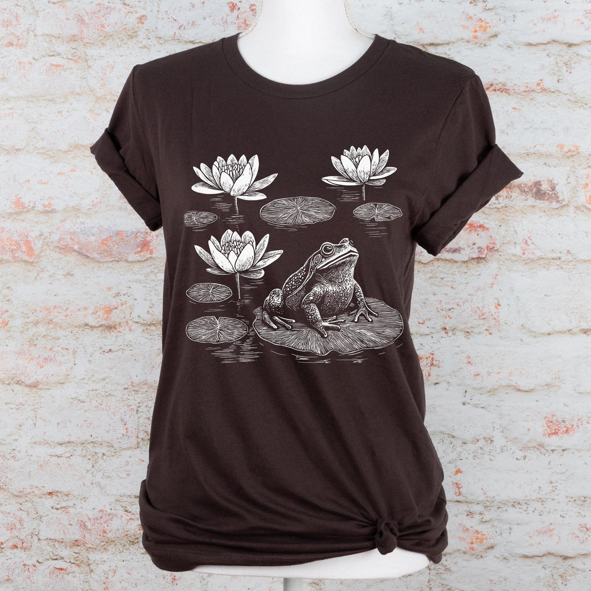 Frog graphic shirt featuring Linocut Frog & Water Lily Graphic Tee