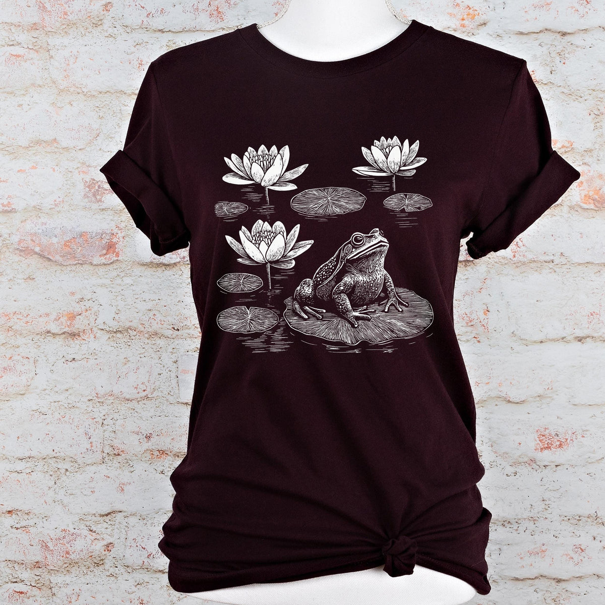 Frog graphic shirt featuring Linocut Frog & Water Lily Graphic Tee