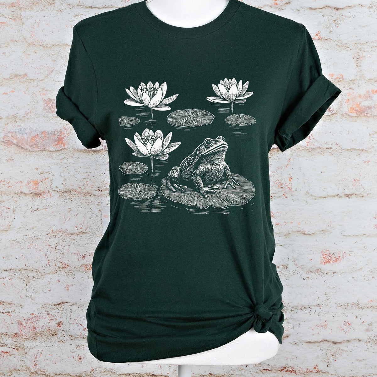 Frog graphic shirt featuring Linocut Frog & Water Lily Graphic Tee