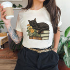 Black Cat Book Lover graphic shirt featuring Floral Book Stack Graphic Tee