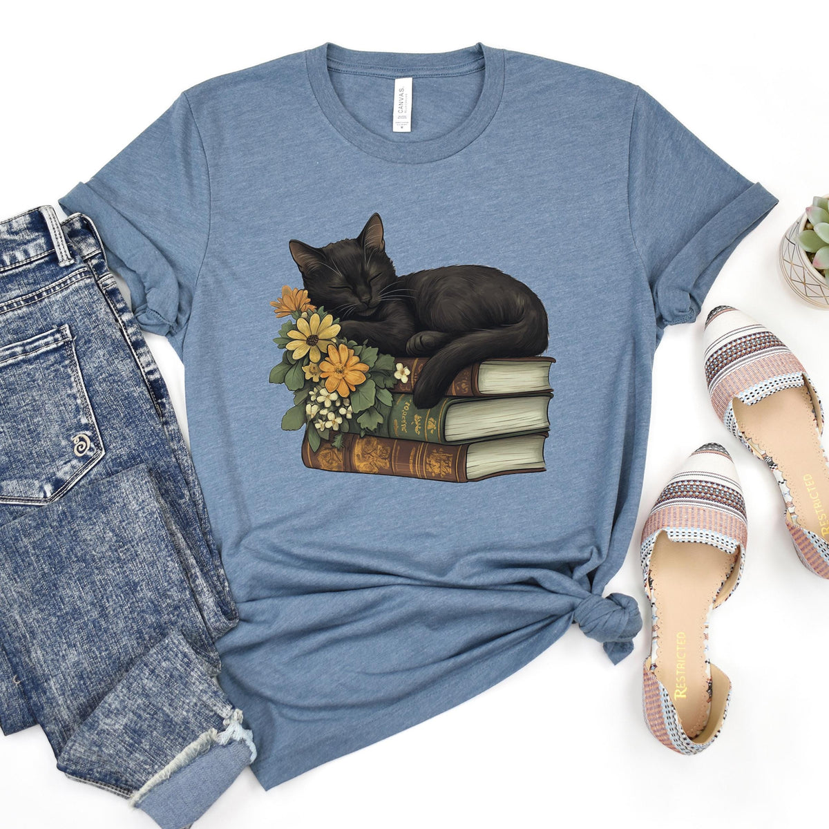 Black Cat Book Lover graphic shirt featuring Floral Book Stack Graphic Tee