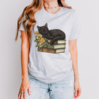 Black Cat Book Lover graphic shirt featuring Floral Book Stack Graphic Tee