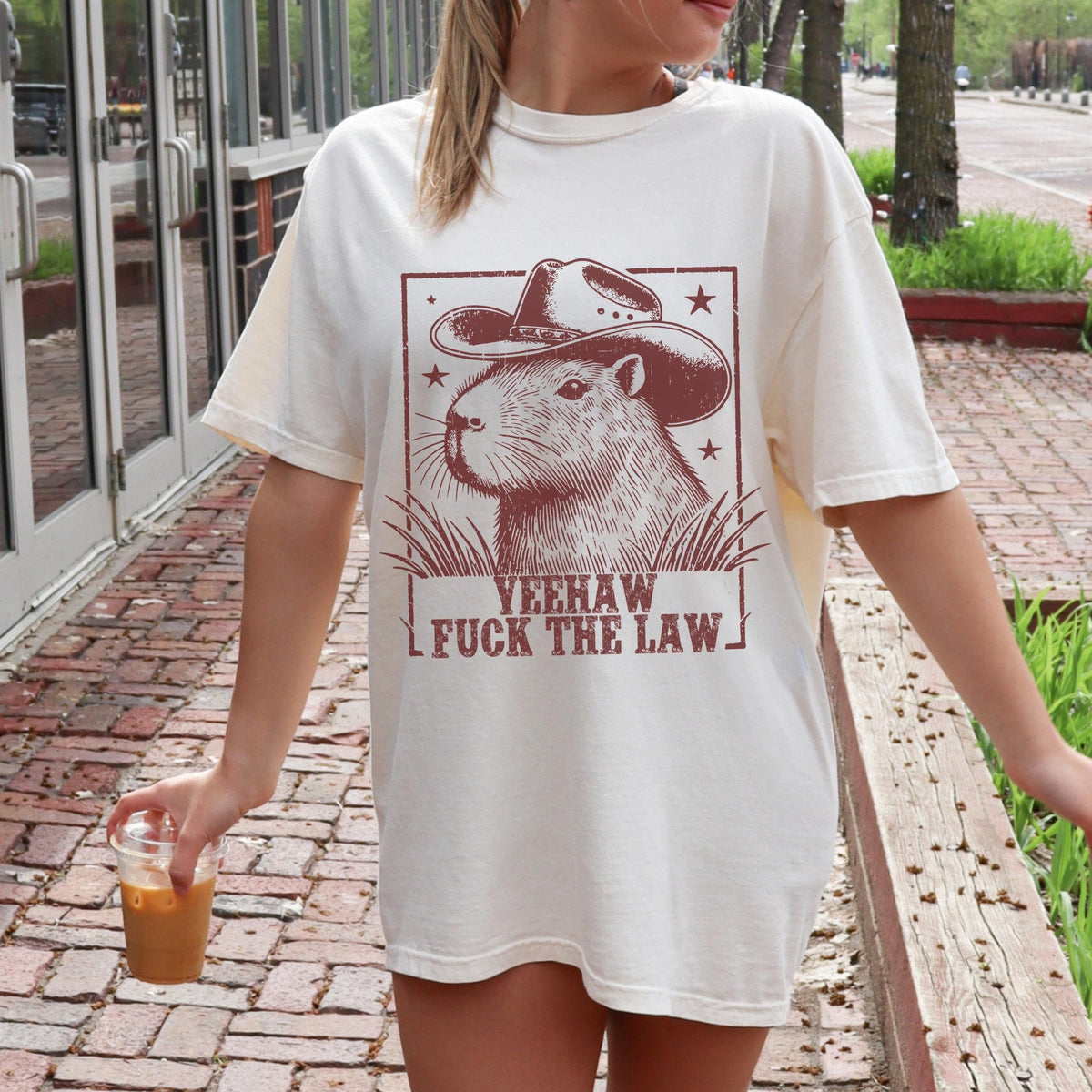 Yeehaw Fuck the Law Capybara graphic shirt featuring Funny Western Animal Graphic Tee in White