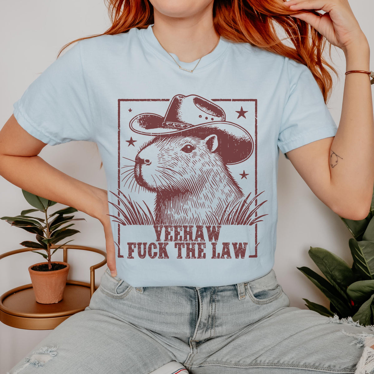 Yeehaw Fuck the Law Capybara graphic shirt featuring Funny Western Animal Graphic Tee