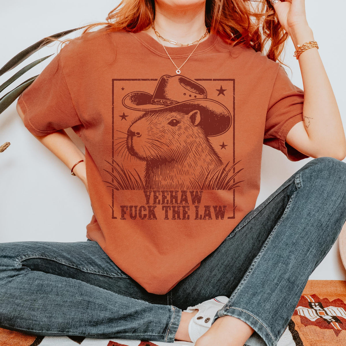 Yeehaw Fuck the Law Capybara graphic shirt featuring Funny Western Animal Graphic Tee