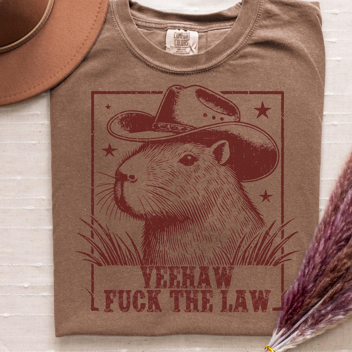 Yeehaw Fuck the Law Capybara graphic shirt featuring Funny Western Animal Graphic Tee