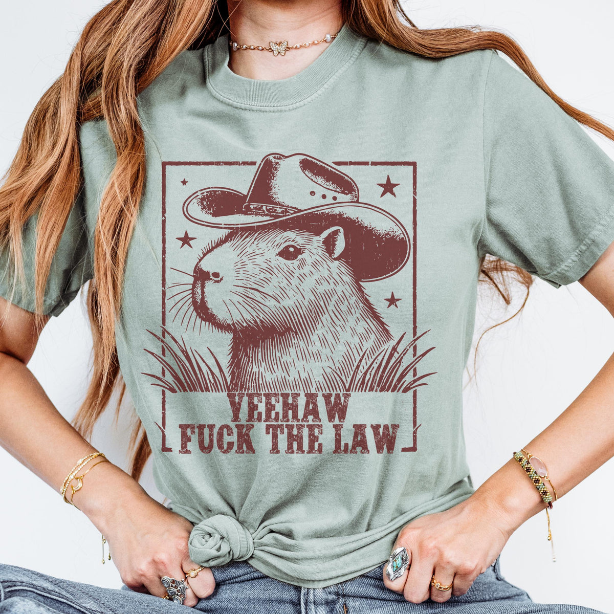 Yeehaw Fuck the Law Capybara graphic shirt featuring Funny Western Animal Graphic Tee