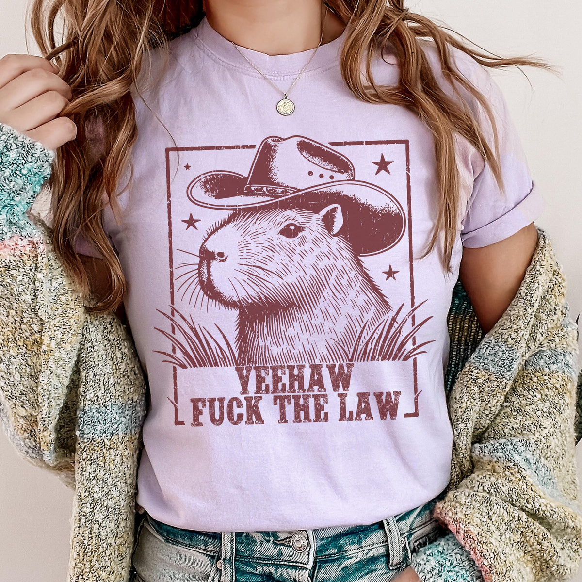 Yeehaw Fuck the Law Capybara graphic shirt featuring Funny Western Animal Graphic Tee