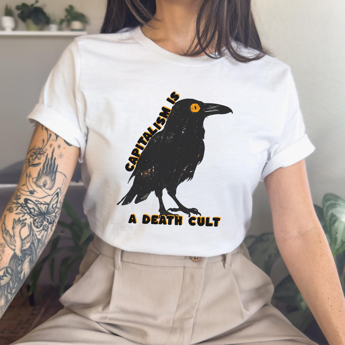 Capitalism Is a Death Cult graphic shirt featuring Vintage Crow in Army