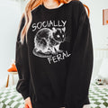 Socially Feral graphic sweatshirt featuring Funny Possum