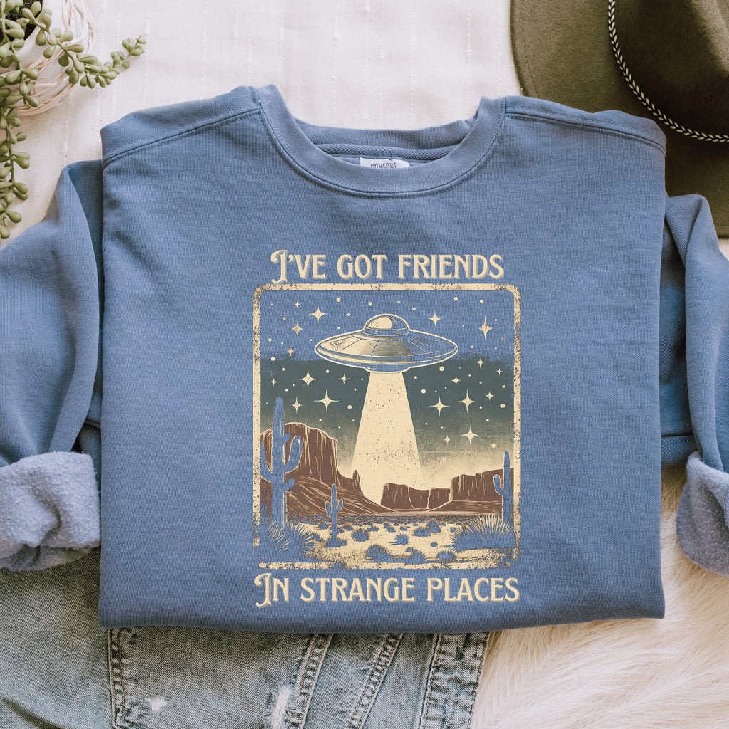 I’ve Got Friends in Strange Places graphic sweatshirt featuring Retro UFO Desert