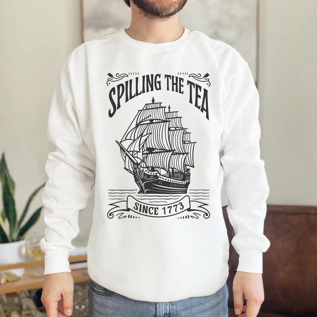 Spilling the Tea Since 1773 graphic sweatshirt featuring Boston Tea Party
