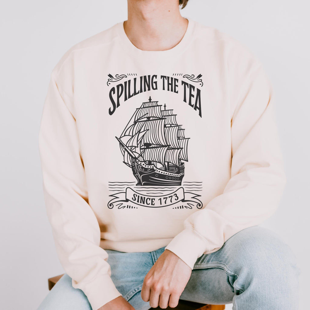 Spilling the Tea Since 1773 graphic sweatshirt featuring Boston Tea Party