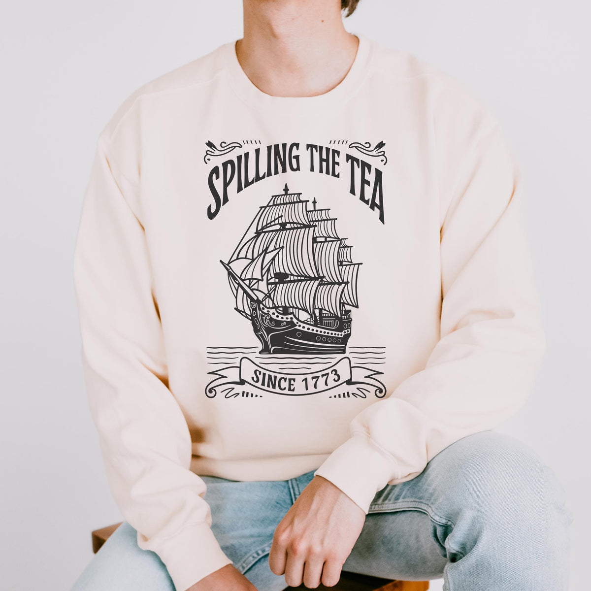 Spilling the Tea Since 1773 graphic sweatshirt featuring Boston Tea Party