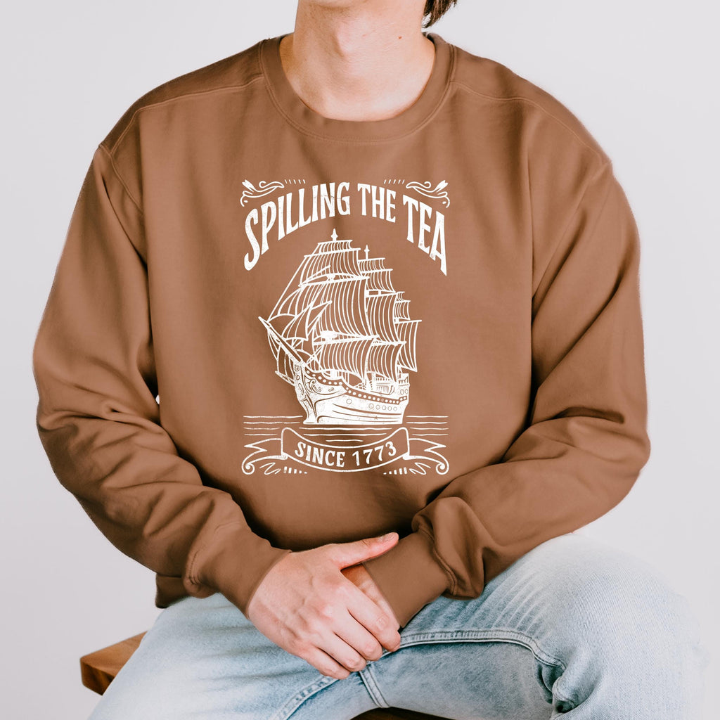 Spilling the Tea Since 1773 graphic sweatshirt featuring Boston Tea Party