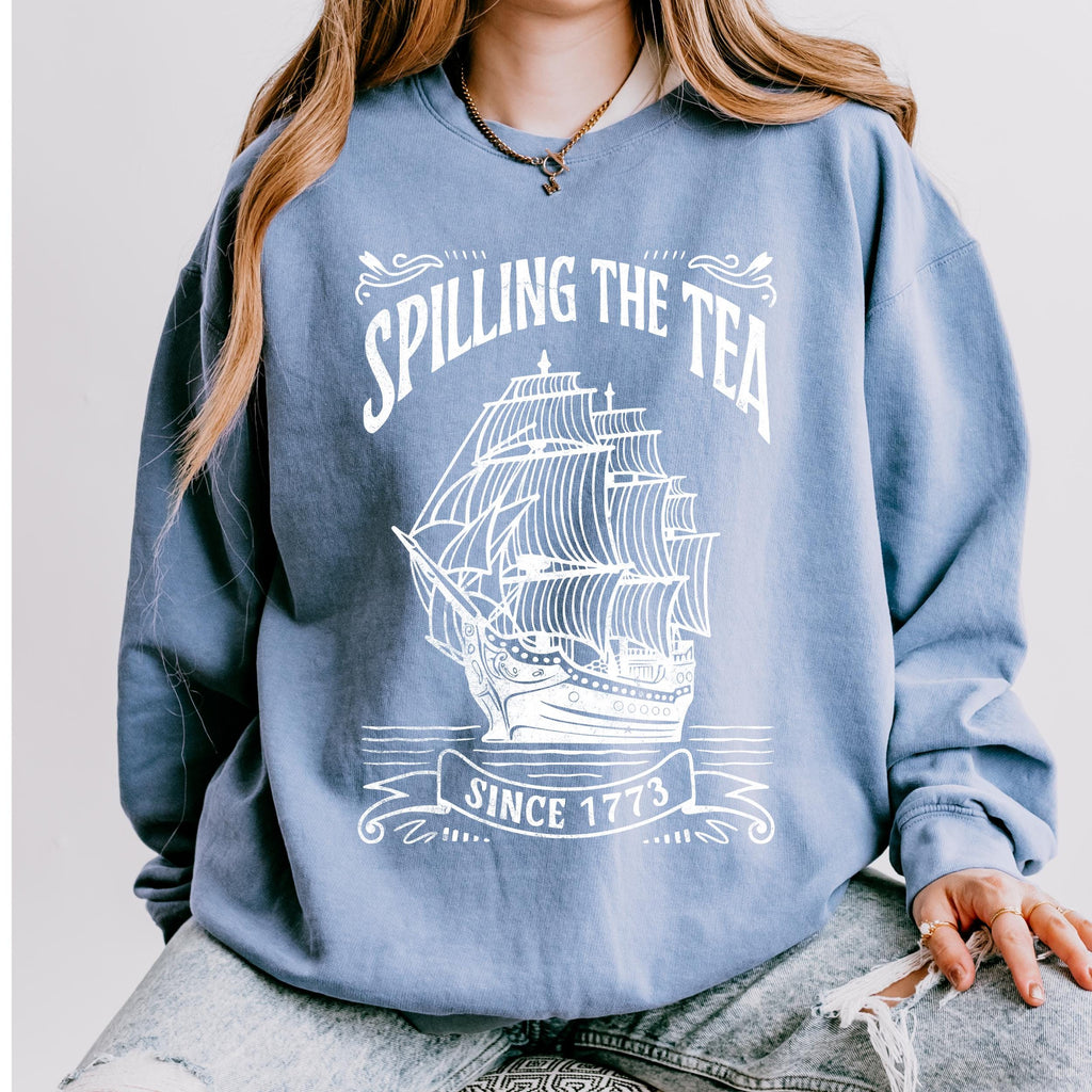 Spilling the Tea Since 1773 graphic sweatshirt featuring Boston Tea Party