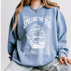 Spilling the Tea Since 1773 graphic sweatshirt featuring Boston Tea Party