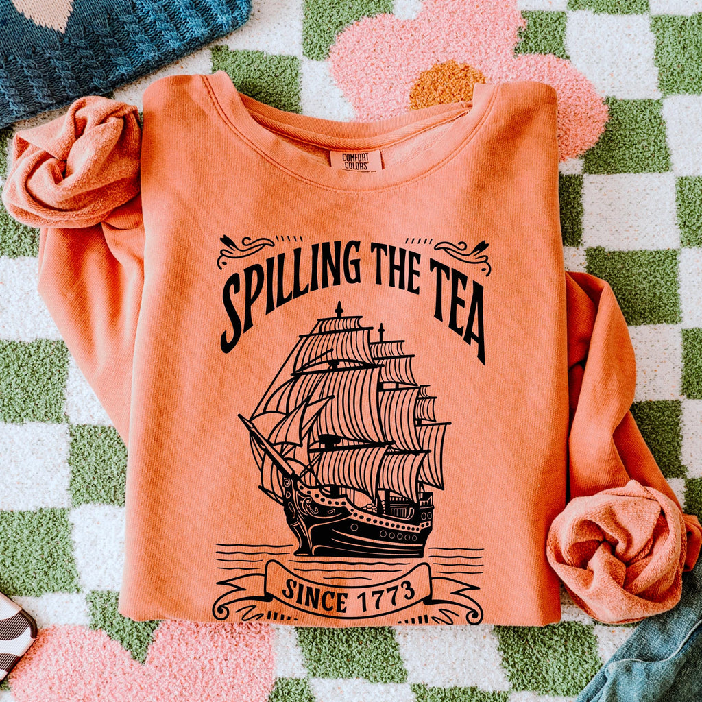 Spilling the Tea Since 1773 graphic sweatshirt featuring Boston Tea Party