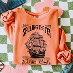 Spilling the Tea Since 1773 graphic sweatshirt featuring Boston Tea Party