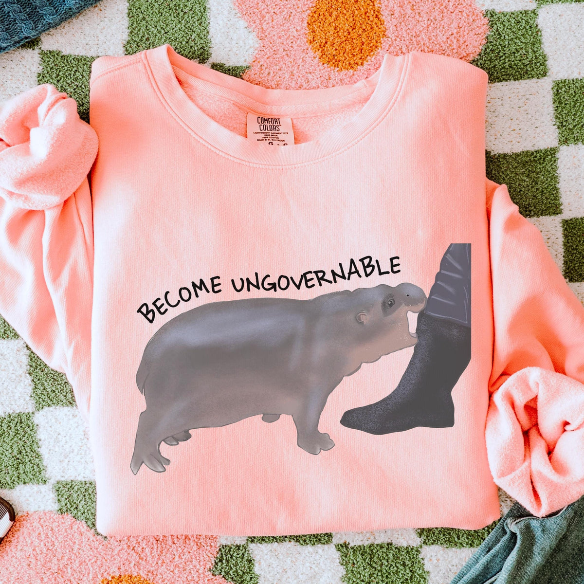 Become Ungovernable graphic sweatshirt featuring Chaotic Baby Hippo