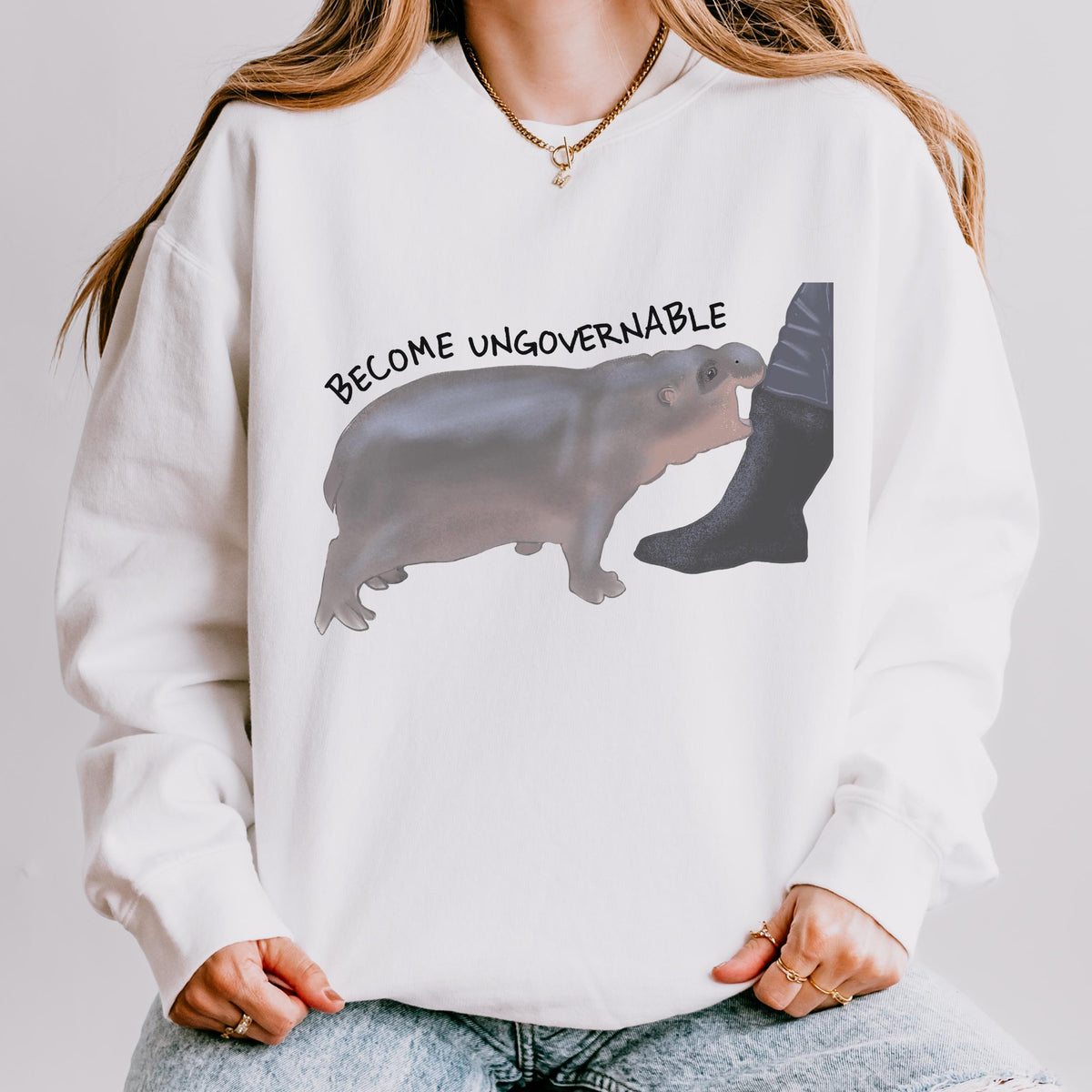 Become Ungovernable graphic sweatshirt featuring Chaotic Baby Hippo in Butter