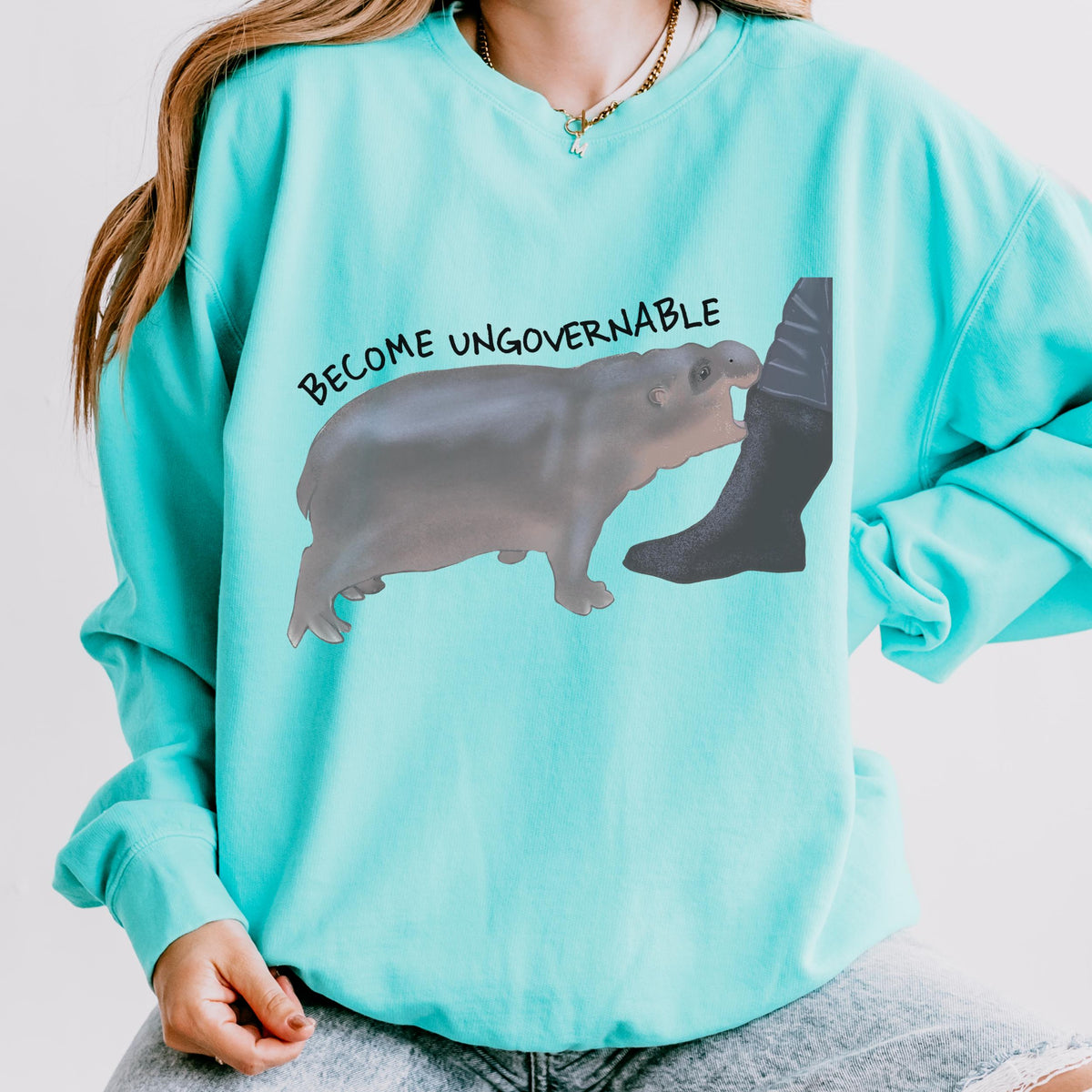 Become Ungovernable graphic sweatshirt featuring Chaotic Baby Hippo