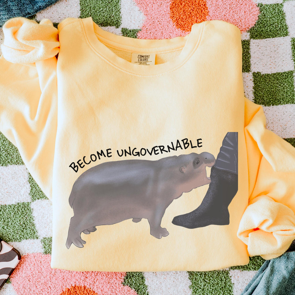 Become Ungovernable graphic sweatshirt featuring Chaotic Baby Hippo