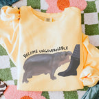 Become Ungovernable graphic sweatshirt featuring Chaotic Baby Hippo