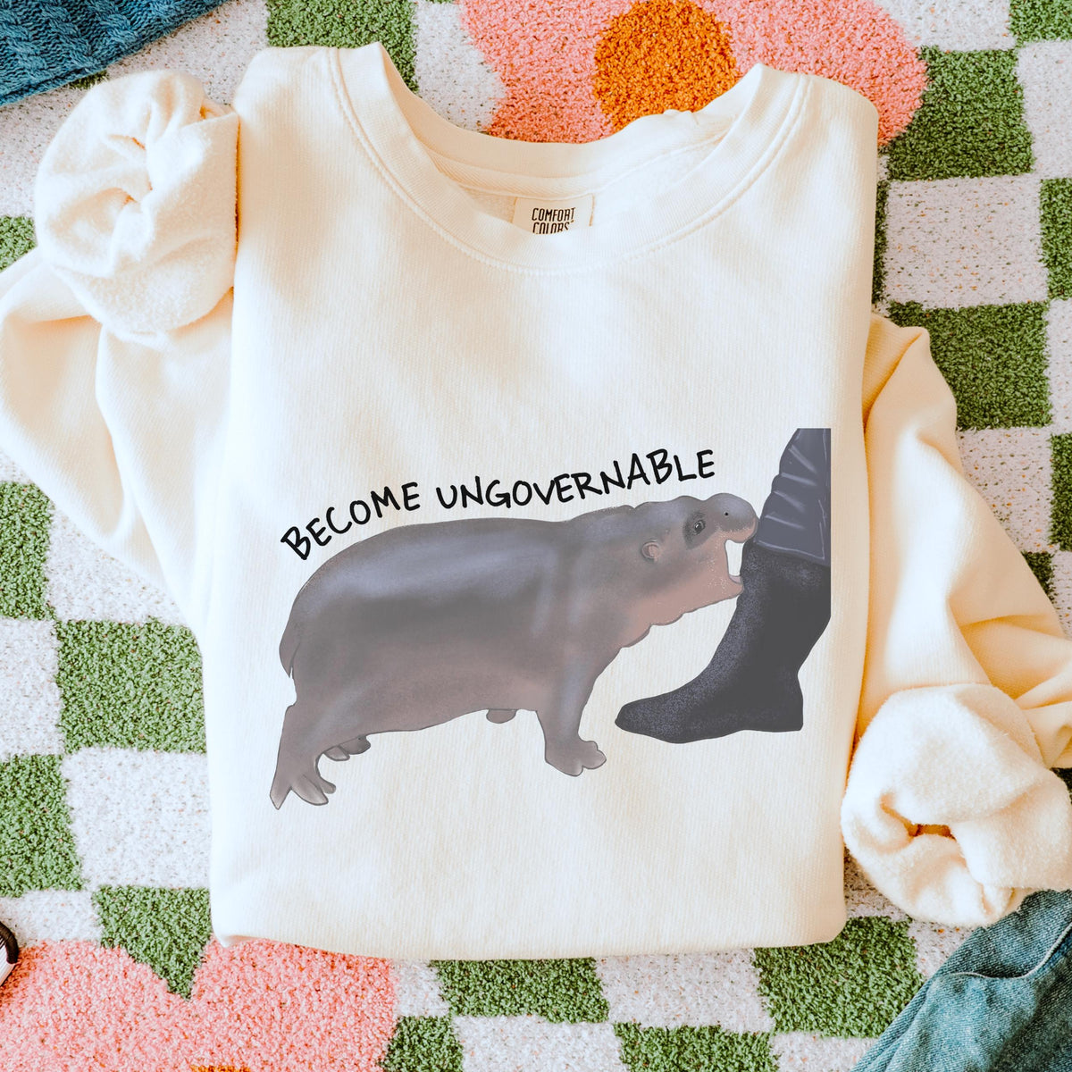 Become Ungovernable graphic sweatshirt featuring Chaotic Baby Hippo