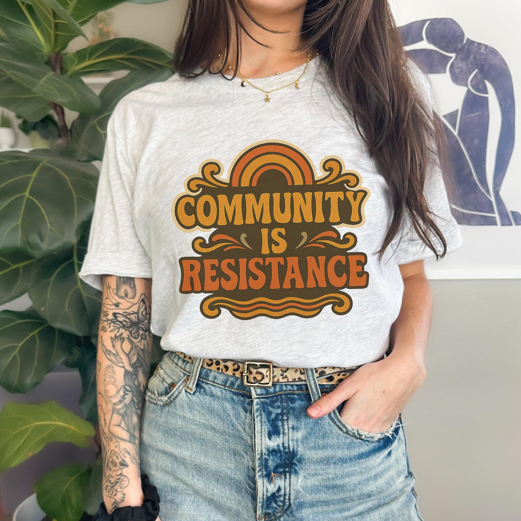 Community Is Resistance graphic shirt featuring Retro Solidarity