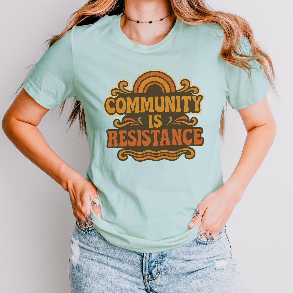 Community Is Resistance graphic shirt featuring Retro Solidarity