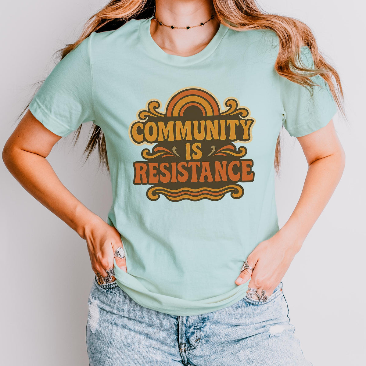 Community Is Resistance graphic shirt featuring Retro Solidarity