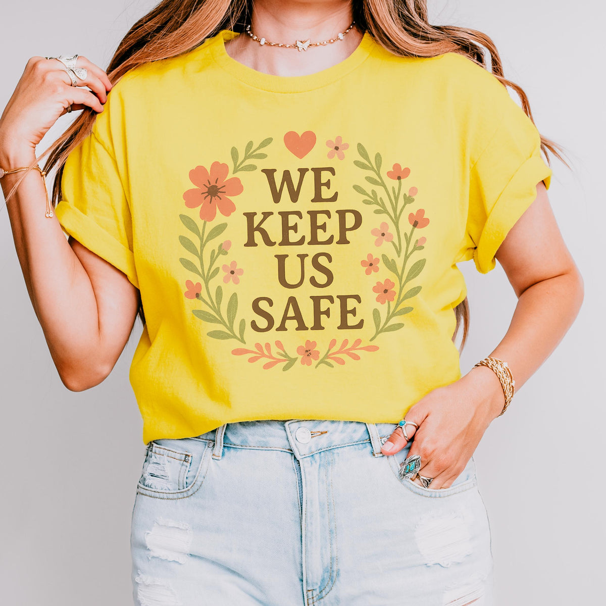 We Keep Us Safe graphic shirt featuring Mutual Aid & Community Care Floral